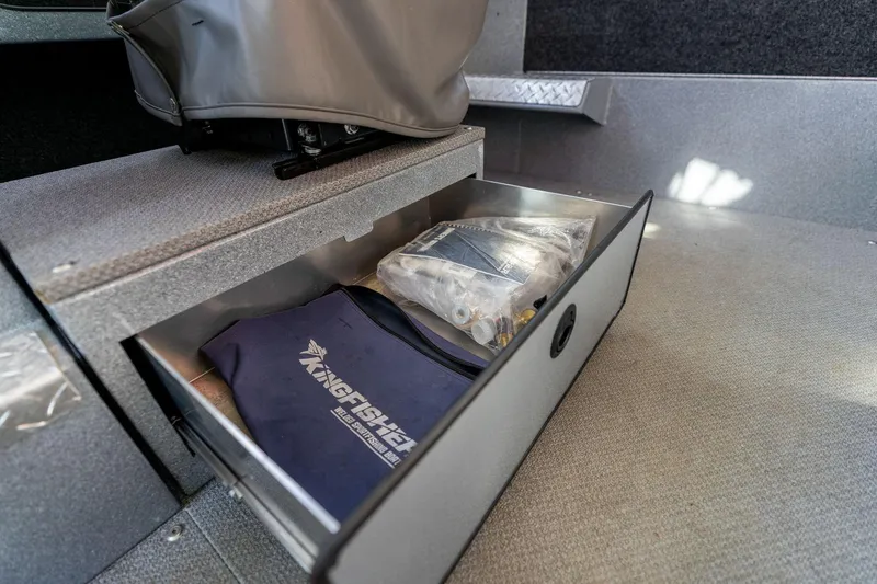 Slide: The Image of Storage drawer in 2021 KingFisher 2825 Coastal Express boat, containing branded items. - 36