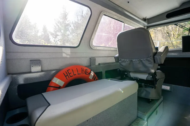 Slide: The Image of Interior of 2021 KingFisher 2825 Coastal Express boat with seating and life preserver. - 37