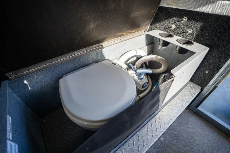 Slide: The Image of 2021 KingFisher 2825 Coastal Express boat interior with compact marine toilet. - 39