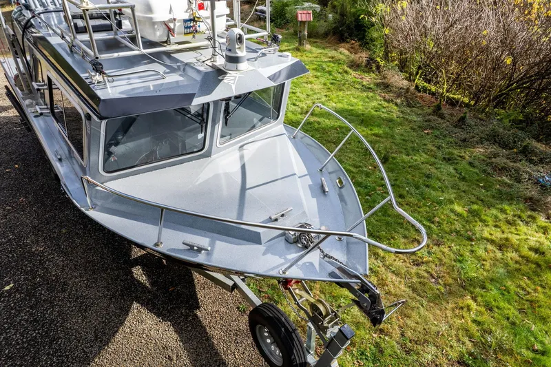 Slide: The Image of 2021 KingFisher 2825 Coastal Express boat on trailer, parked on grass. - 43