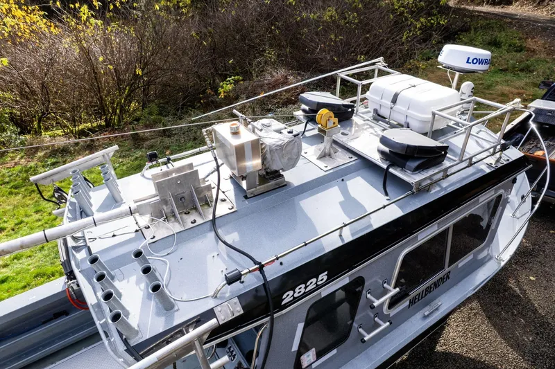 Slide: The Image of Top view of 2021 KingFisher 2825 Coastal Express boat with equipment on deck. - 45