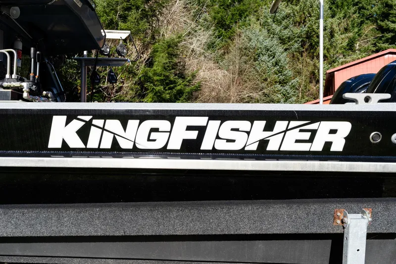 Slide: The Image of KingFisher 2825 Coastal Express 2021 boat logo with forest background. - 53