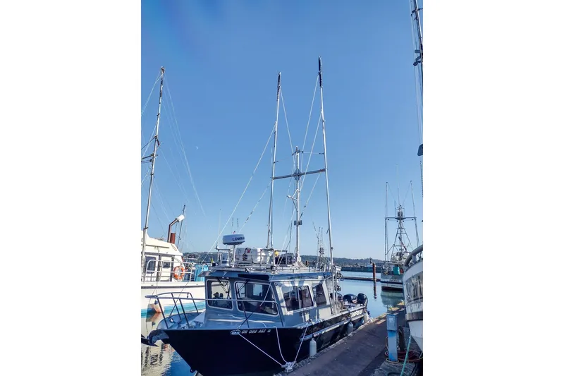 Slide: The Image of 2021 KingFisher 2825 Coastal Express boat docked at marina under clear blue sky. - 57