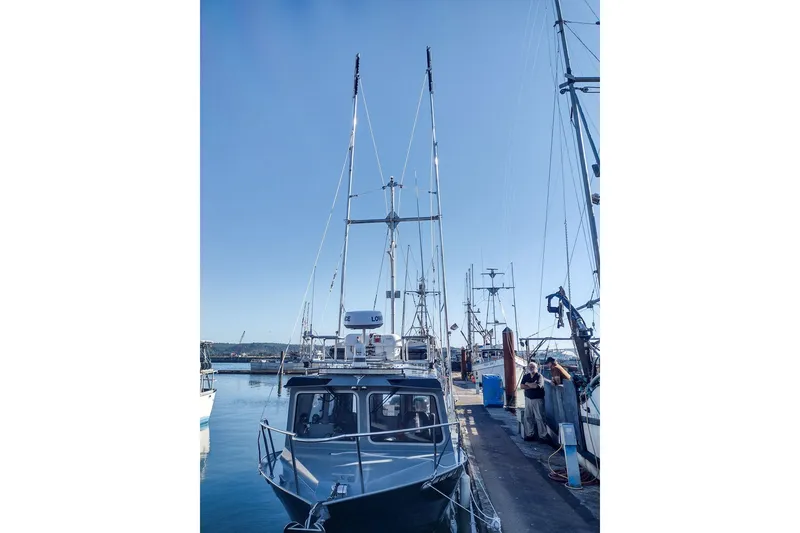Slide: The Image of 2021 KingFisher 2825 Coastal Express docked at marina under clear blue sky. - 58