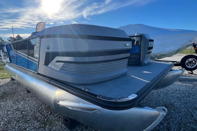 The Image of 2026 Sylvan R22 Rear Partyfish pontoon boat under a bright blue sky. - 0