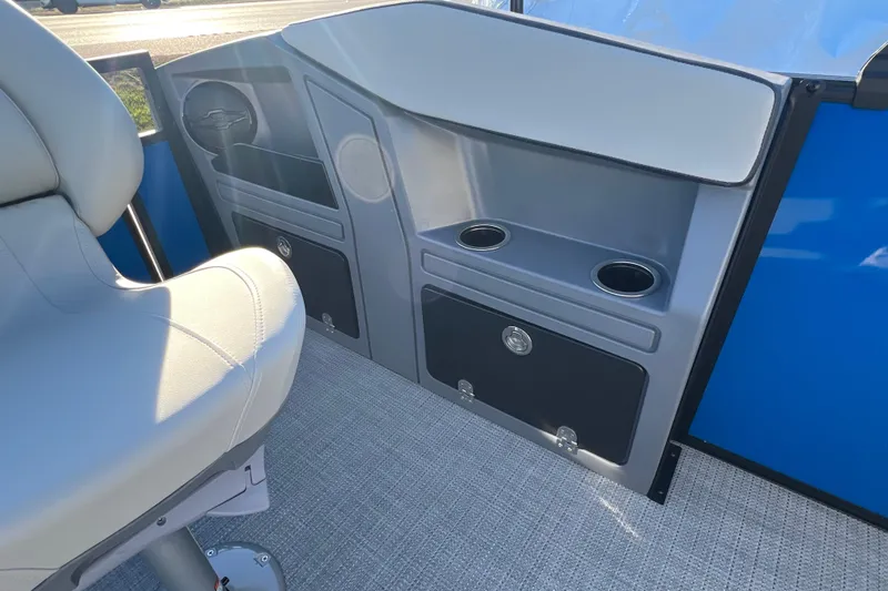 Slide: The Image of Interior of 2026 Sylvan R22 Rear Partyfish boat with seating and storage compartments. - 12