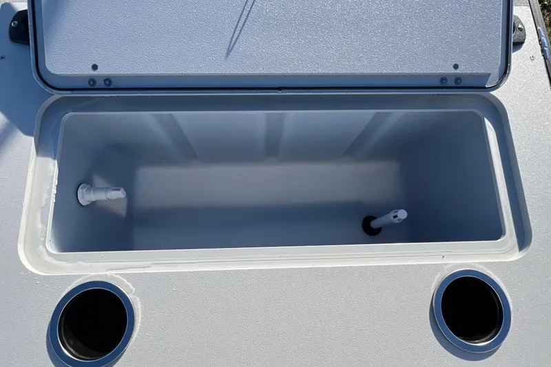 Slide: The Image of Open storage compartment on 2026 Sylvan R22 Rear Partyfish boat. - 13