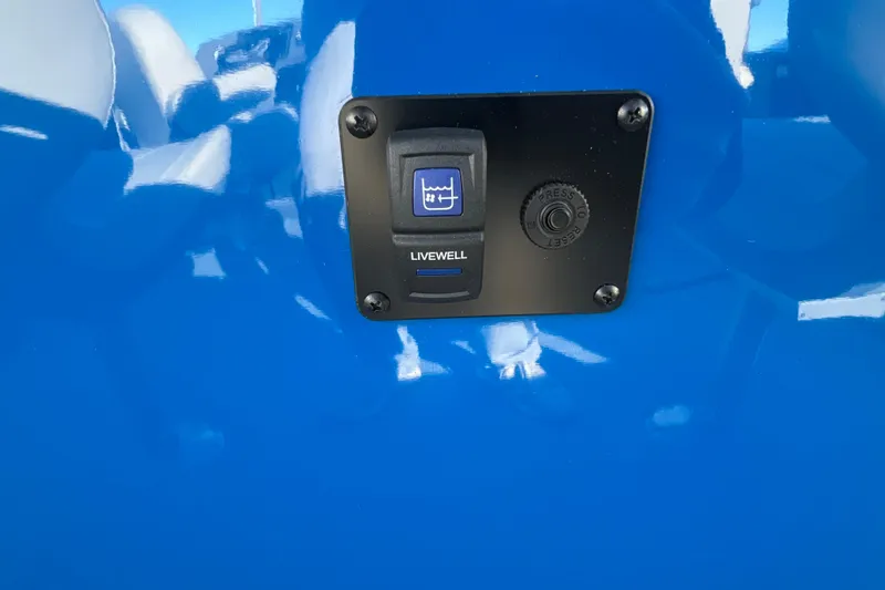 Slide: The Image of 2026 Sylvan R22 Rear Partyfish livewell switch on blue panel. - 14