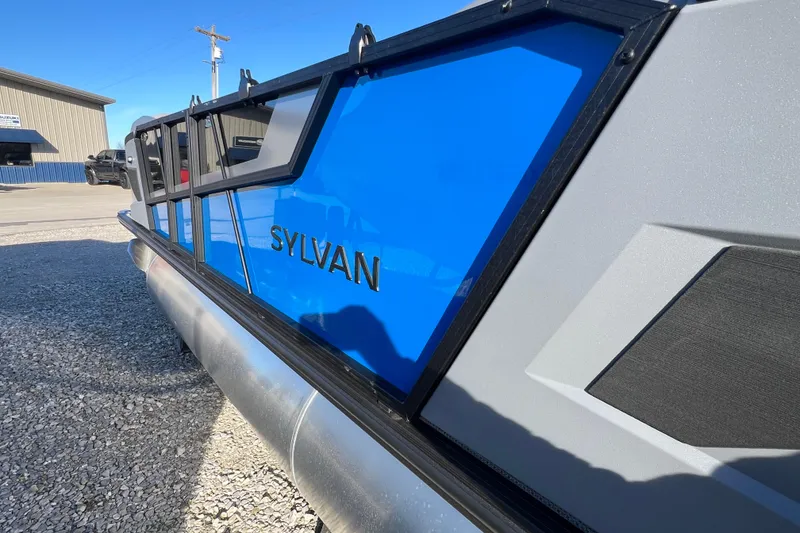 Slide: The Image of 2026 Sylvan R22 Rear Partyfish pontoon boat with sleek blue and gray design. - 3