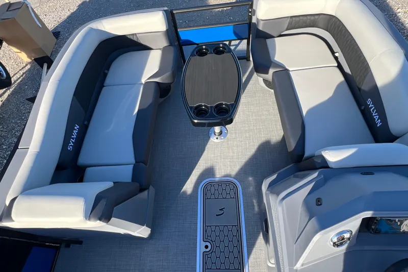 Slide: The Image of 2026 Sylvan R22 Rear Partyfish boat interior with gray seating and central table. - 5
