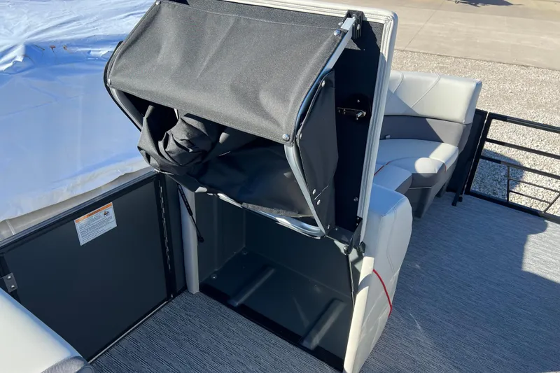 Slide: The Image of 2026 Sylvan X3 DLZ Bar interior with seating and storage compartment. - 19