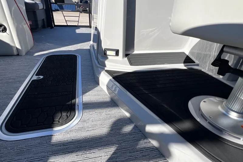 Slide: The Image of Interior of 2026 Sylvan X3 DLZ Bar boat with modern flooring and seating. - 20