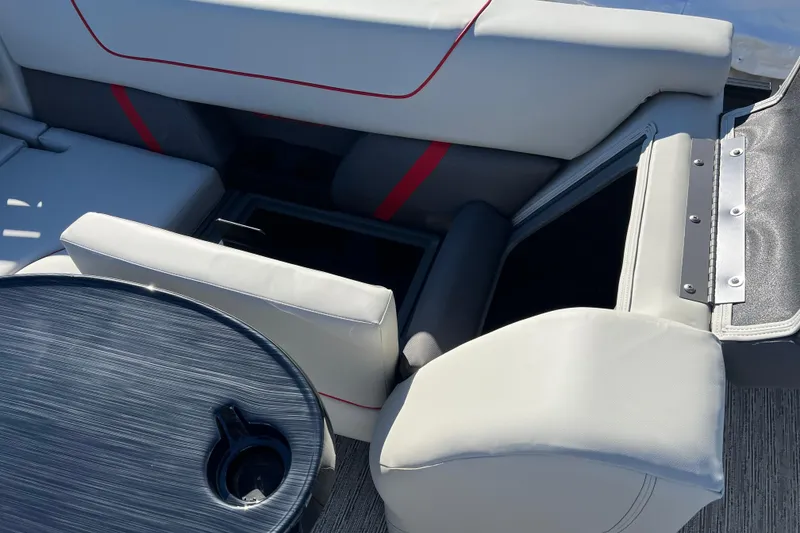 Slide: The Image of 2026 Sylvan X3 DLZ Bar boat interior with seating and table. - 22