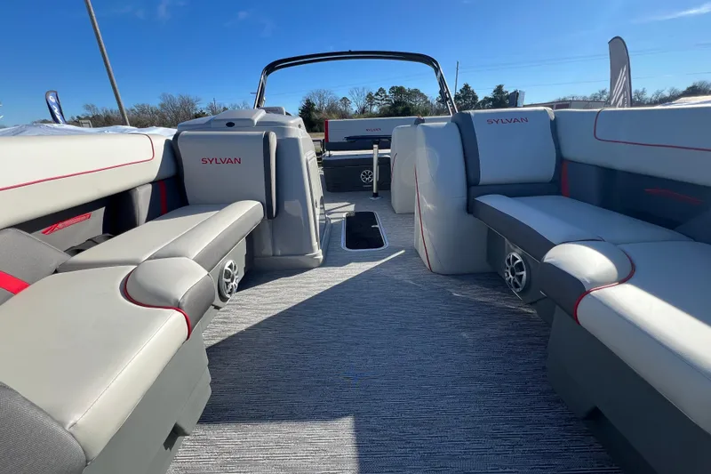 Slide: The Image of 2026 Sylvan X3 DLZ Bar pontoon boat interior with plush seating and modern design. - 5