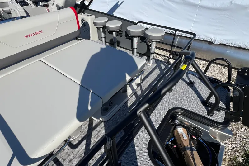 Slide: The Image of 2026 Sylvan X3 DLZ Bar pontoon boat interior with seating and bar stools. - 7