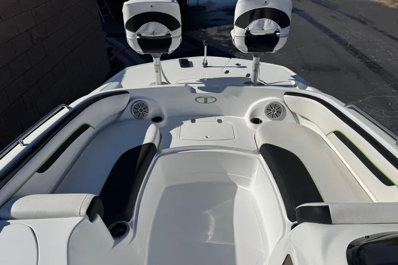 Slide: The Image of 2020 Tahoe 215 Xi boat interior with seating and speakers, showcasing modern design. - 13