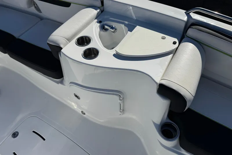 Slide: The Image of 2020 Tahoe 215 Xi boat interior with cup holders and seating area. - 18