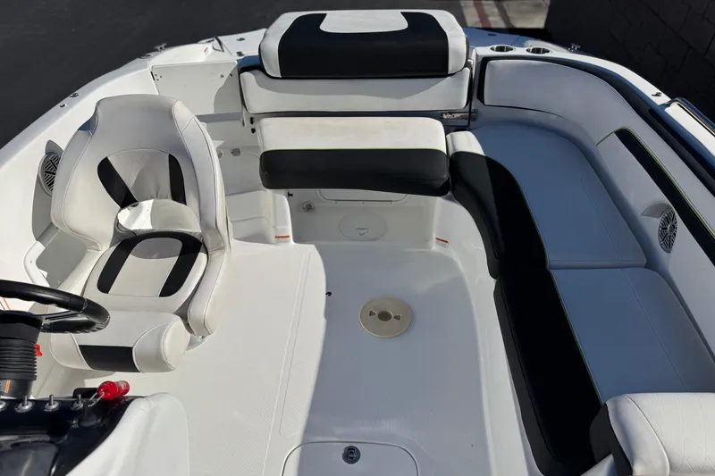 Slide: The Image of 2020 Tahoe 215 Xi boat interior with white and black seating arrangement. - 20