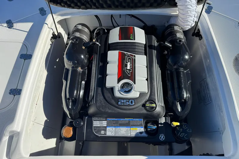 Slide: The Image of Engine compartment of a 2020 Tahoe 215 Xi boat, featuring a powerful 250 horsepower engine. - 22
