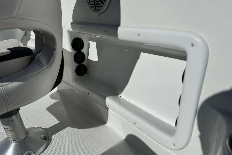 Slide: The Image of Interior of 2020 Tahoe 215 Xi boat, featuring seating and control panel. - 23