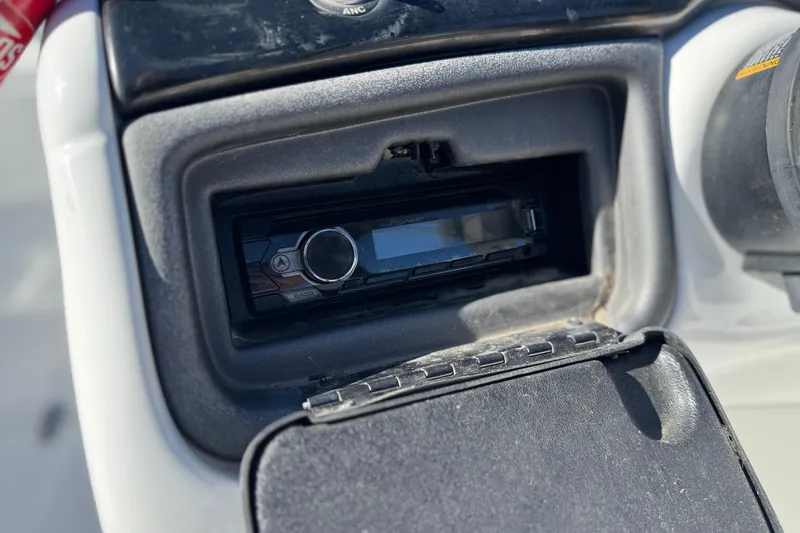 Slide: The Image of Boat stereo system in a 2020 Tahoe 215 Xi, featuring a sleek design. - 27