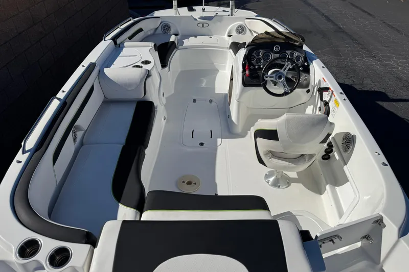 Slide: The Image of 2020 Tahoe 215 Xi boat interior with seating and steering console. - 9