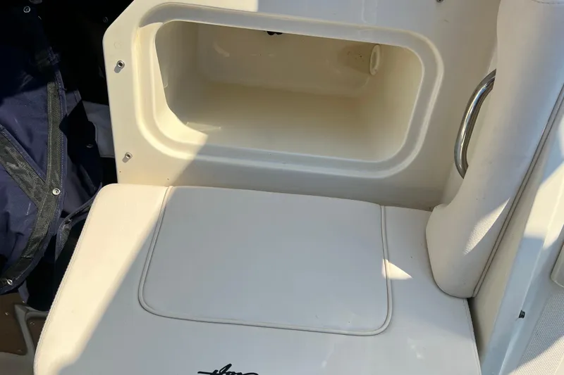 Slide: The Image of 2017 Chris-Craft Calypso 26 boat seat with storage compartment. - 15