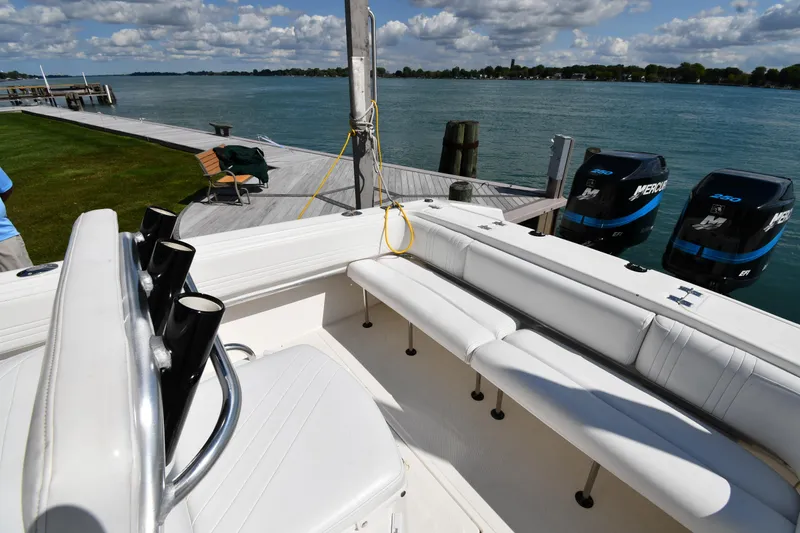 Slide: The Image of 2000 Fountain 31 Tournament Edition boat docked by a scenic waterfront. - 23