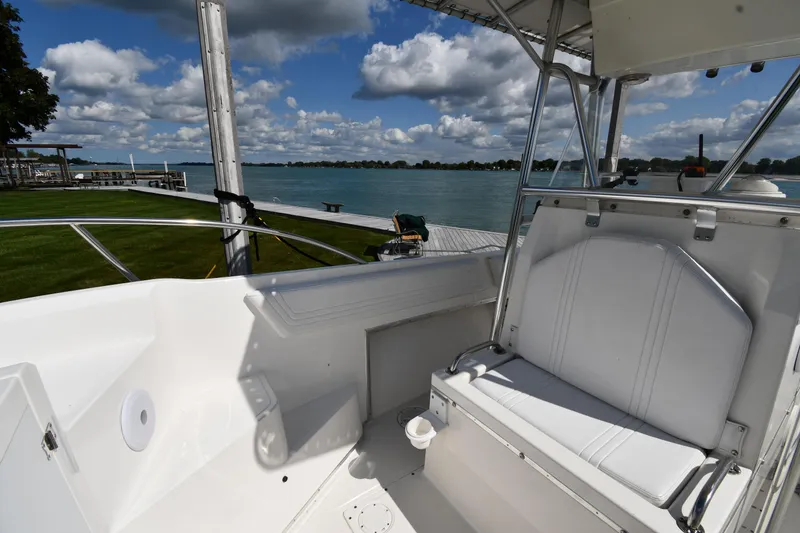 Slide: The Image of 2000 Fountain 31 Tournament Edition boat interior with lake view and seating area. - 32