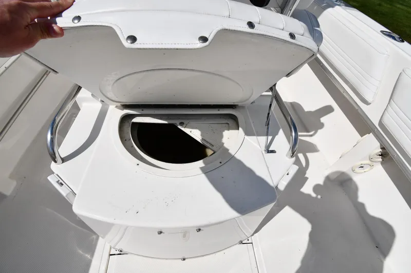 Slide: The Image of Open storage compartment on 2000 Fountain 31 Tournament Edition boat. - 37