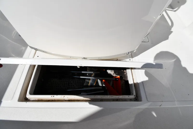 Slide: The Image of Open storage compartment on 2000 Fountain 31 Tournament Edition boat deck. - 38