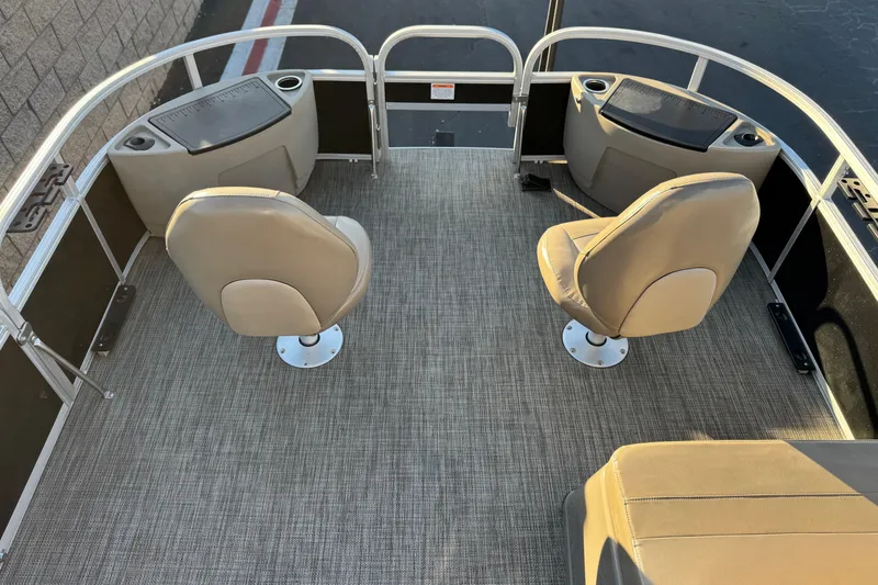 Slide: The Image of 2023 Ranger Reata 200F boat interior with two swivel seats and carpeted flooring. - 10