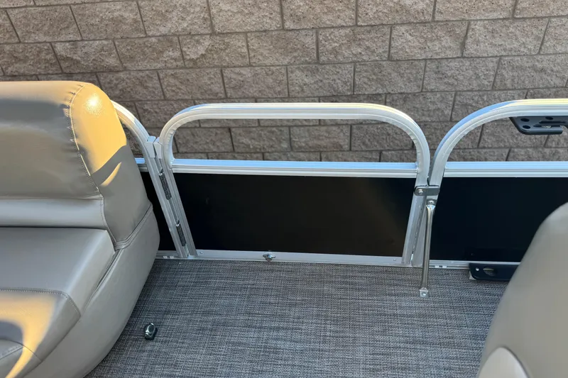 Slide: The Image of 2023 Ranger Reata 200F boat interior with gray seating and metal railing. - 18