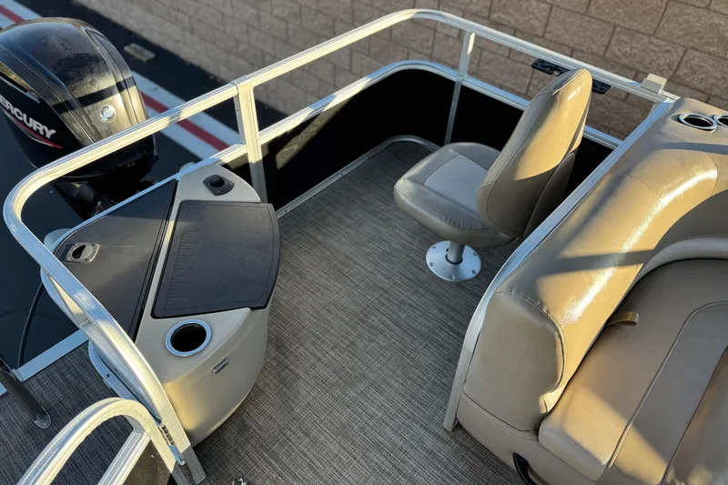 Slide: The Image of 2023 Ranger Reata 200F boat interior with seating and Mercury engine. - 20