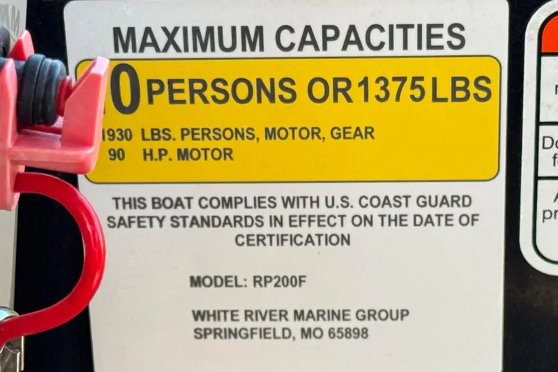 Slide: The Image of 2023 Ranger Reata 200F capacity label, 10 persons or 1375 lbs, U.S. Coast Guard compliant. - 30