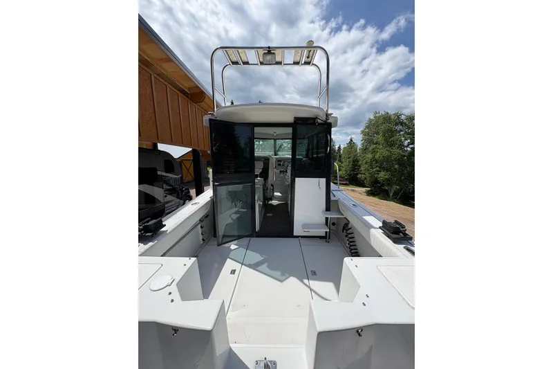 Slide: The Image of 2001 Glacier Bay 2690 Coastal Runner boat with open cockpit. - 10