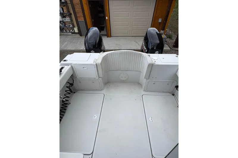 Slide: The Image of 2001 Glacier Bay 2690 Coastal Runner boat deck with dual outboard motors. - 28