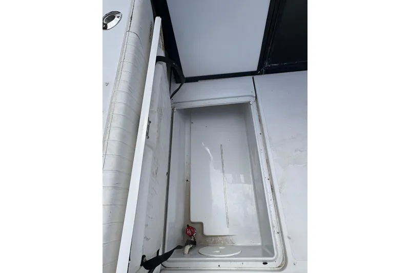 Slide: The Image of Open storage compartment on 2001 Glacier Bay 2690 Coastal Runner boat. - 33