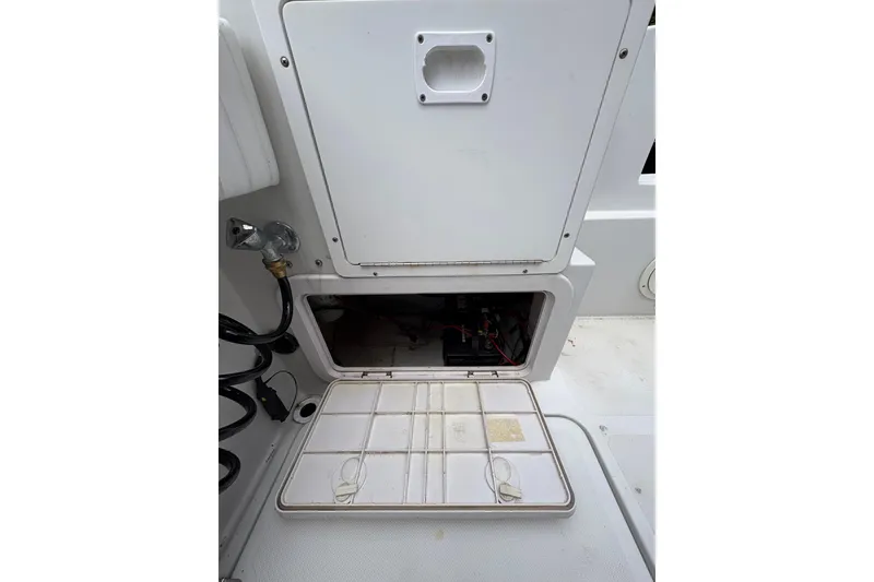 Slide: The Image of Open storage compartment on 2001 Glacier Bay 2690 Coastal Runner boat. - 34