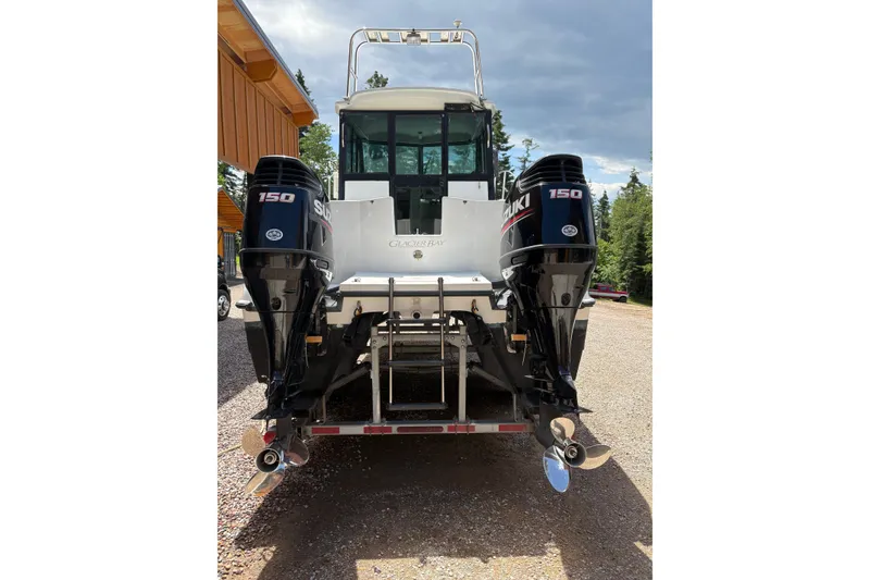 Slide: The Image of 2001 Glacier Bay 2690 Coastal Runner with dual Suzuki 150 outboard motors. - 38