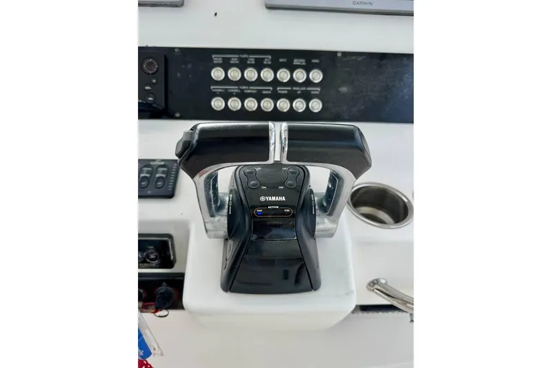 Slide: The Image of Control panel of a 2014 Edgewater 280CC boat with Yamaha throttle. - 28