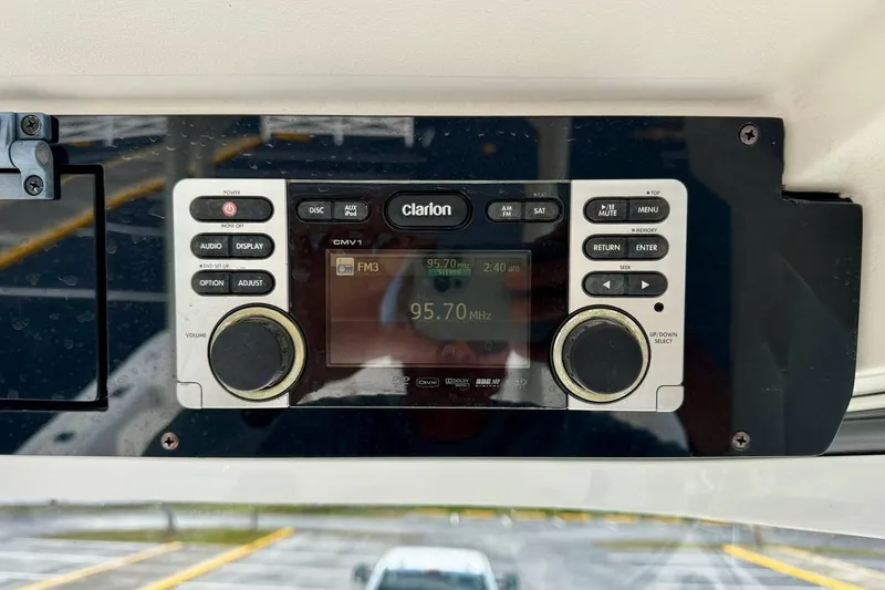 Slide: The Image of Clarion radio system on 2014 Edgewater 280CC boat, displaying FM 95.70 MHz. - 29