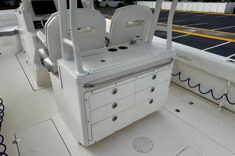 Slide: The Image of 2014 Edgewater 280CC boat interior with seating and storage compartments. - 34