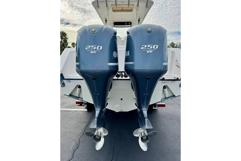 Slide: The Image of 2014 Edgewater 280CC boat with twin Yamaha 250 V6 outboard engines. - 49