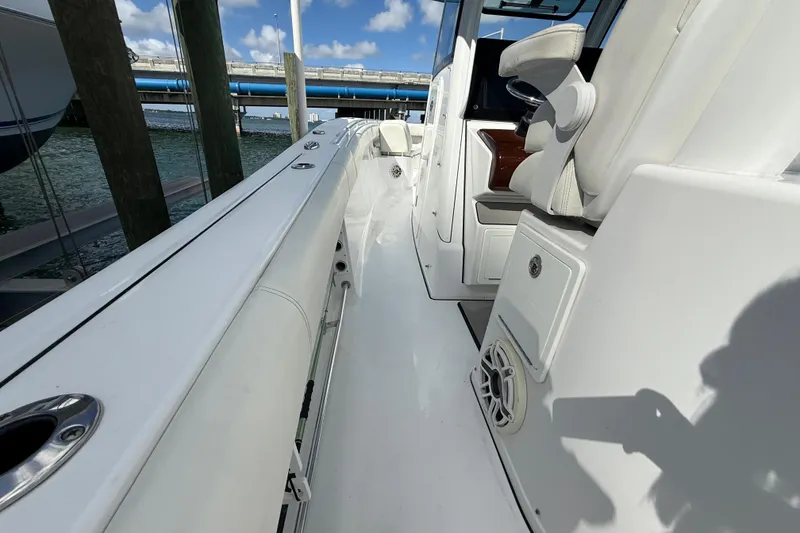 Slide: The Image of 2020 Sportsman Open 352 Center Console boat interior with seating and storage. - 26