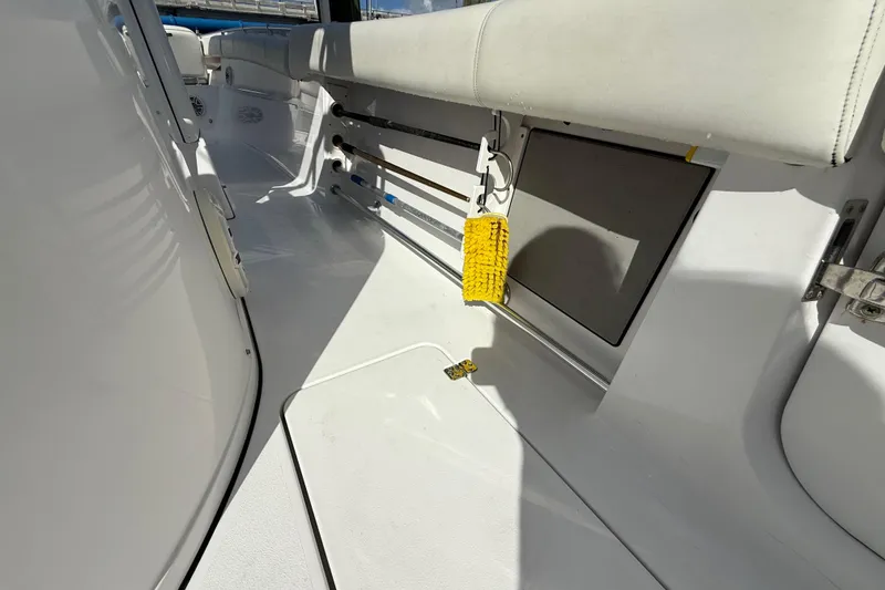 Slide: The Image of 2020 Sportsman Open 352 Center Console interior with seating and storage. - 27