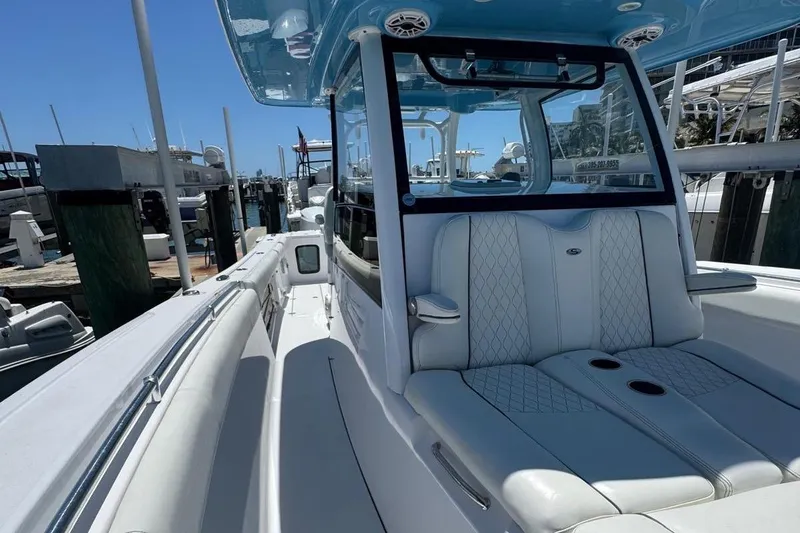 Slide: The Image of 2020 Sportsman Open 352 Center Console boat docked, featuring sleek seating and modern design. - 37