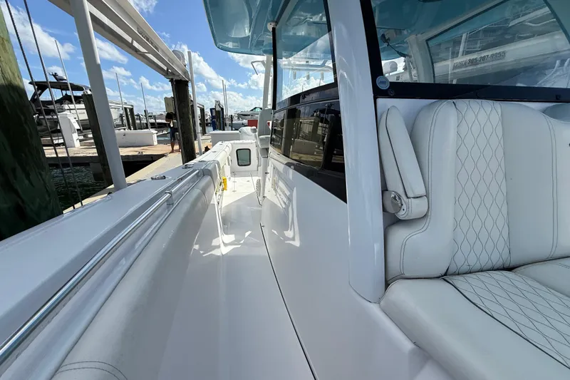 Slide: The Image of 2020 Sportsman Open 352 Center Console boat with white seating and sleek design. - 41