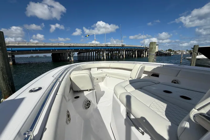 Slide: The Image of 2020 Sportsman Open 352 Center Console boat interior near a bridge on a sunny day. - 42