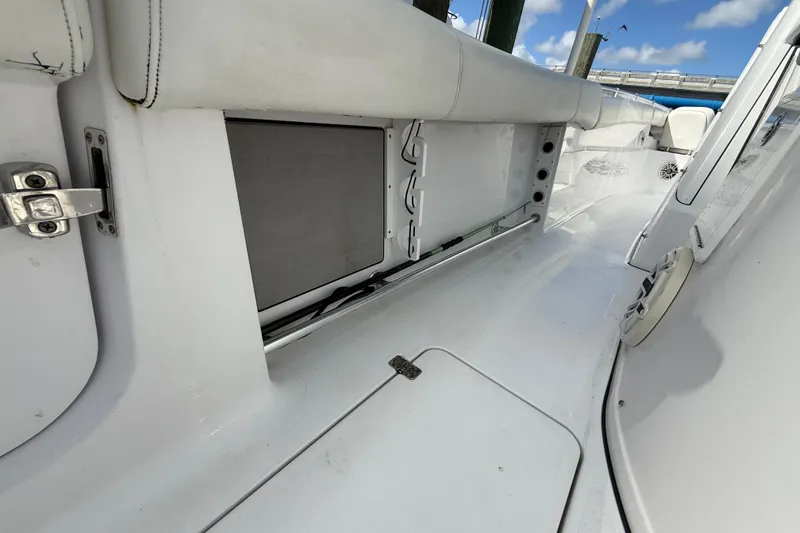 Slide: The Image of 2020 Sportsman Open 352 Center Console interior with storage compartment and seating. - 44